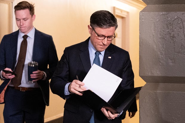 Speaker of the House Mike Johnson arrives for the House Republican Conference caucus meeting in the Capitol on Tuesday, Dec. 17, 2024.