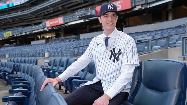 New York Yankees' Max Fried smiles while posing for photographs following a baseball news conference, Wednesday, Dec. 18, 2024, in New York. 