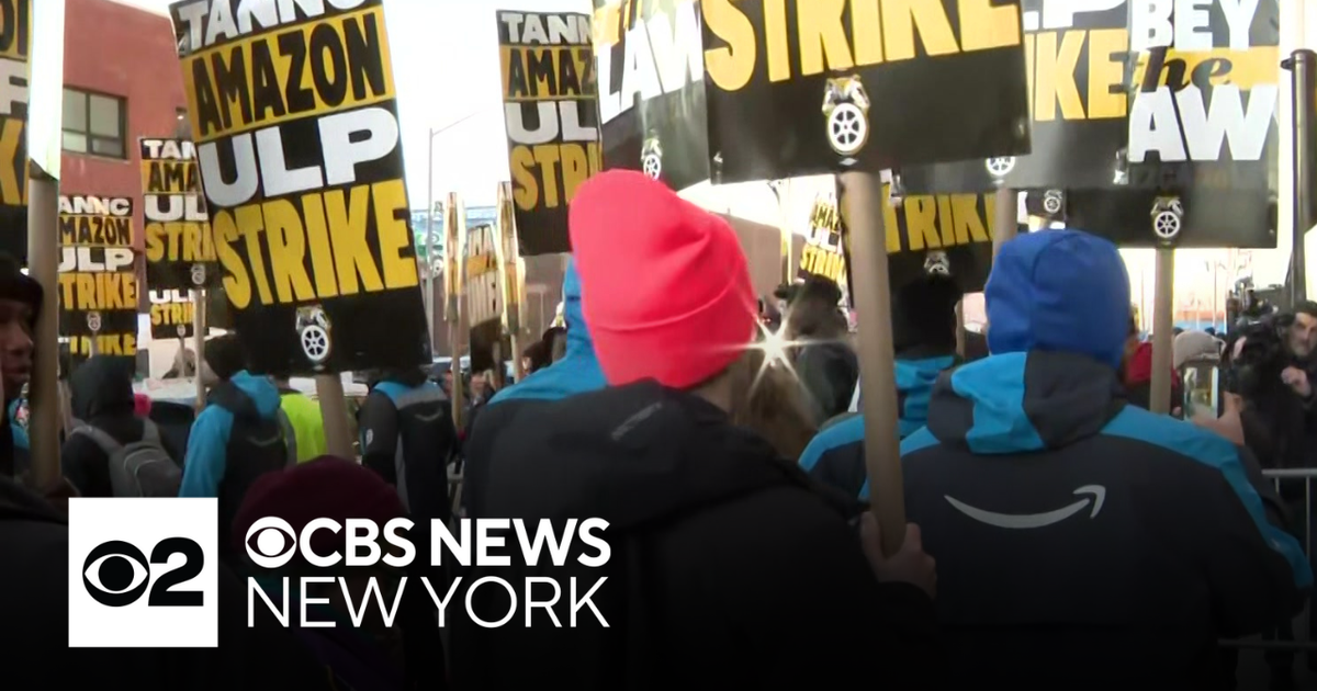 Picket line blocks trucks from leaving Amazon warehouse in Queens - CBS ...