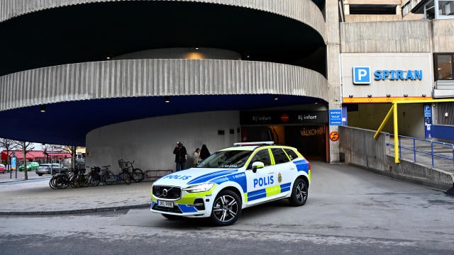 A police car  stands near a parking garage where rapper Gaboro was shot dead on Thursday evening, in central Norrkoping 