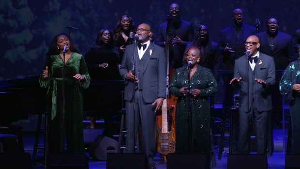 Samara Joy on stage with family