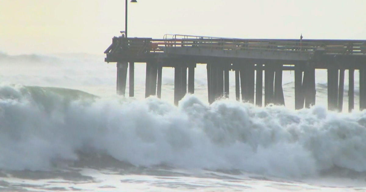 Huge waves tear through Santa Cruz wharf, sending debris into the ocean