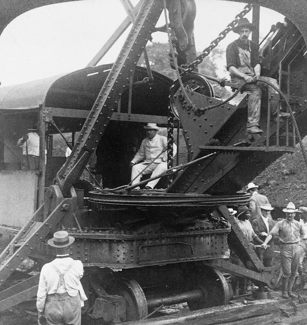 Theodore Roosevelt sitting in a crane on the Panama Canal