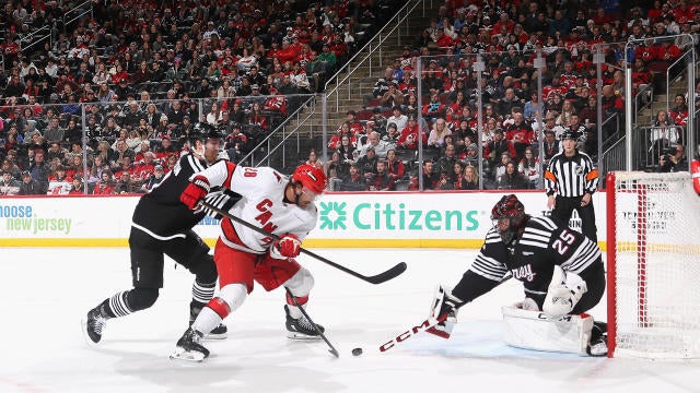 Jacob Markstrom #25 of the New Jersey Devils makes a first period save against William Carrier #28 of the Carolina Hurricanes at Prudential Center on December 27, 2024 in Newark, New Jersey. 