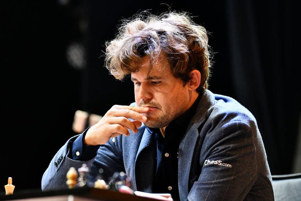 Norwegian Grandmaster Magnus Carlsen plays chess during