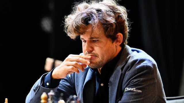 Norwegian Grandmaster Magnus Carlsen plays chess during the 