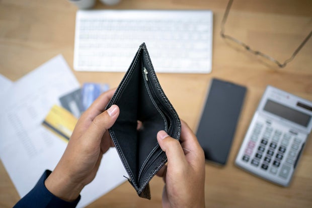 hand open empty purse looking for money having problem bankrupt broke