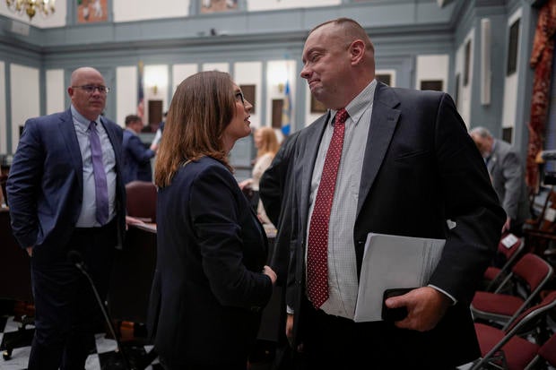 U.S.-Rep.-elect Sarah McBride shakes hands and talks with Delaware Senate Republican Minority Whip Brian Pettyjohn on the Senate floor 