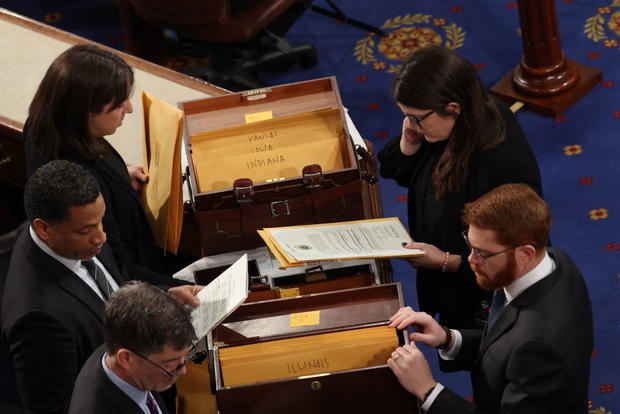 Congressional clerks review electoral votes during of a joint session of Congress to certify the results of the 2024 presidential election, inside the House Chamber at the Capitol on Jan. 6, 2025. 