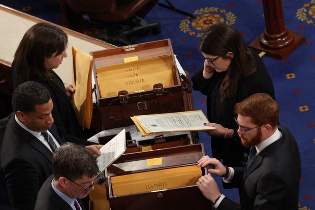 Congressional clerks review electoral votes during of a joint session of Congress to certify the results of the 2024 presidential election, inside the House Chamber at the Capitol on Jan. 6, 2025.