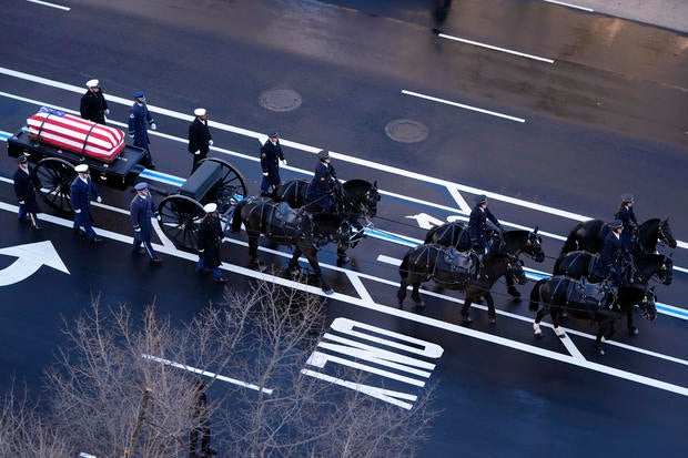 Funeral Procession Brings Body Of Former President Jimmy Carter To U.S. Capitol Building 