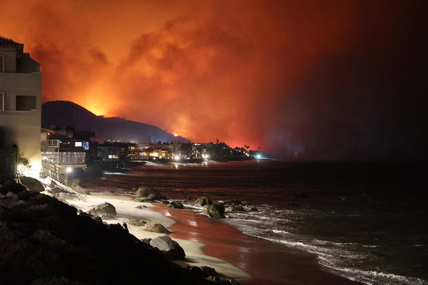 Firefighters continue battling Palisades fire in Los Angeles as flames rage out of control 