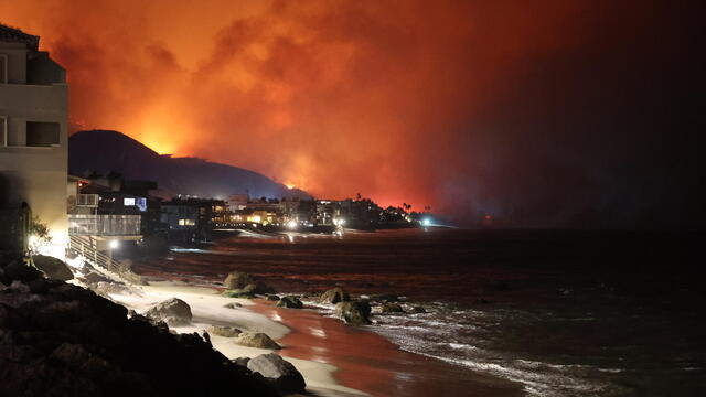 Firefighters continue battling Palisades fire in Los Angeles as flames rage out of control 