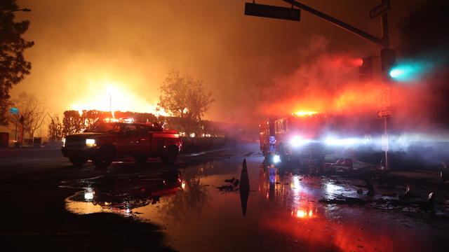 Firefighters continue battling Palisades fire in Los Angeles as flames rage out of control 