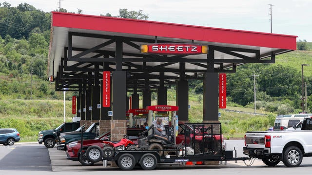 Vehicles are seen at the gas pumps of a Sheetz convenience 