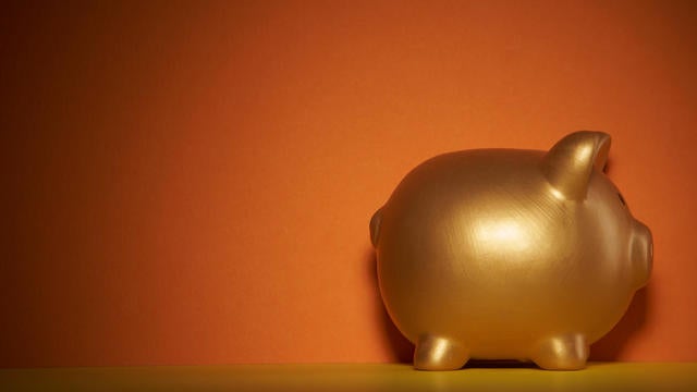 gold colored piggy bank 