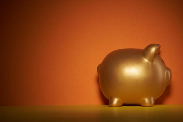 gold colored piggy bank