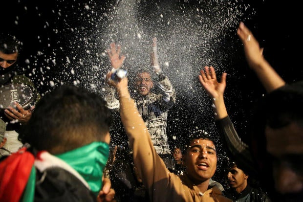 Palestinians react to news on a ceasefire deal with Israel, in Khan Younis in the southern Gaza Strip 