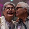 Thai LGBT couple poses for a photo during the registration 