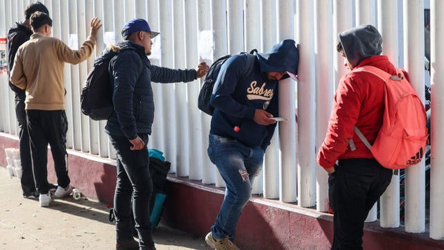 Asylum seekers gather on Avenida Jose Maria Larroque in Tijuana, Mexico, on Tuesday, Jan. 21, 2025, after the cancellation of the CBP One program, following weeks or months of waiting for a U.S. entry appointment. 