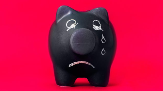 Finance problems, sad piggy bank with no coins 