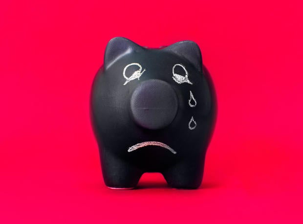 Finance problems, sad piggy bank with no coins 