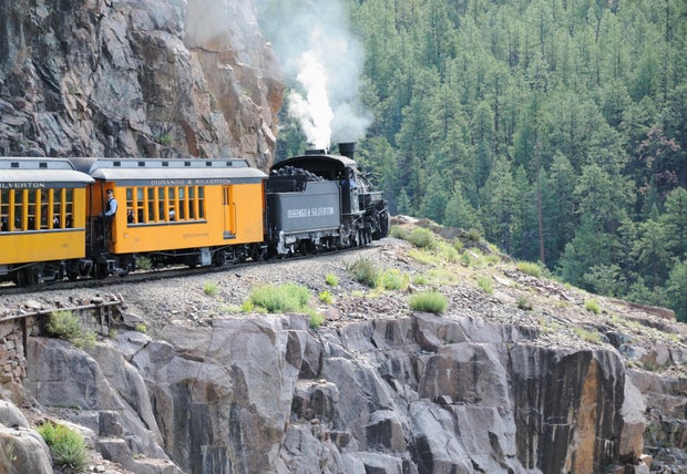 Durango and Silverton train rounding mountain curve 