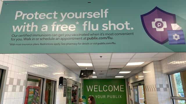 Sign at entrance of Publix grocery store advertising Flu Shot services, Palm Beach, Florida 