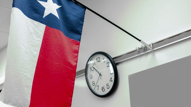 Texas high school classroom flag, clock.