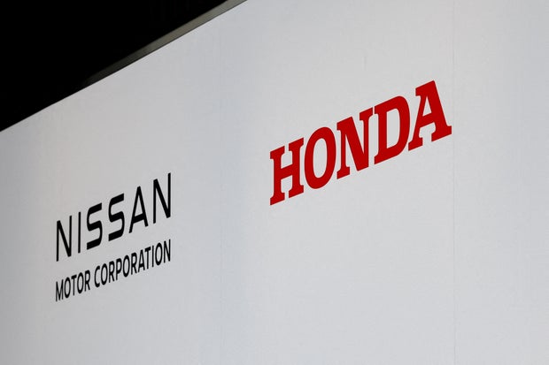 FILE PHOTO: Honda, Nissan and Mitsubishi Motors hold a joint press conference on their merger talks
