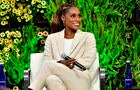 Issa Rae smiles. 