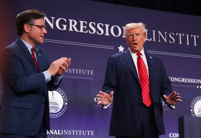 President Trump acknowledges the crowd as House Speaker Mike Johnson looks on before addressing the 2025 Republican Issues Conference at the Trump National Doral Miami on Jan. 27, 2025, in Doral, Florida.  