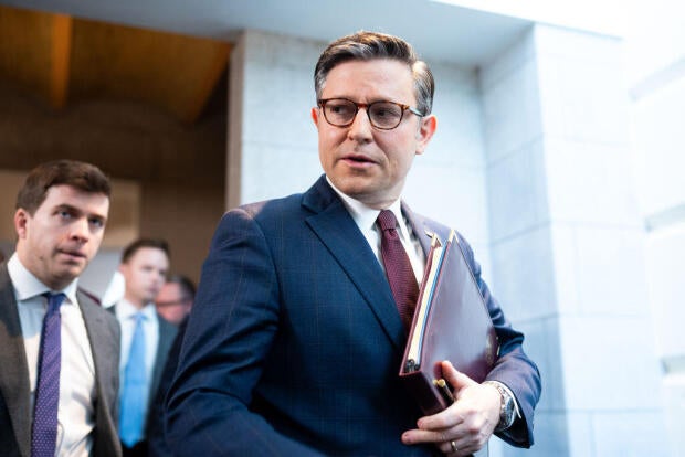 Speaker Mike Johnson arrives for the House Republican Conference meeting in the Capitol on Feb. 25, 2024. 