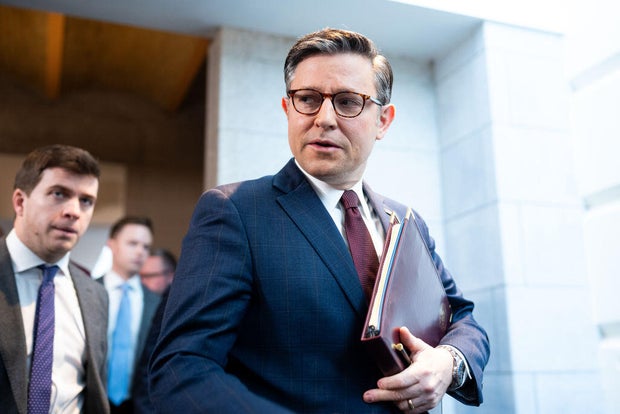 Speaker Mike Johnson arrives for the House Republican Conference meeting in the Capitol on Feb. 25, 2024.