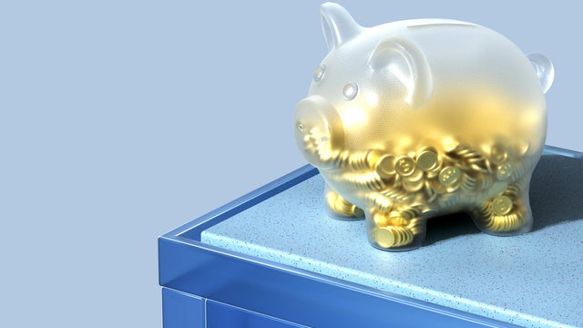 Glowing Glass Piggy Bank With Gold Dollar Coins 