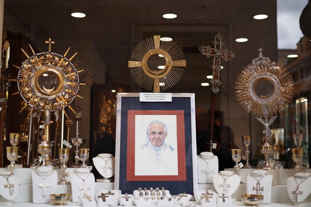 An image of Pope Francis is displayed in a store in Rome on February 26, 2025, while he continues his hospitalization.