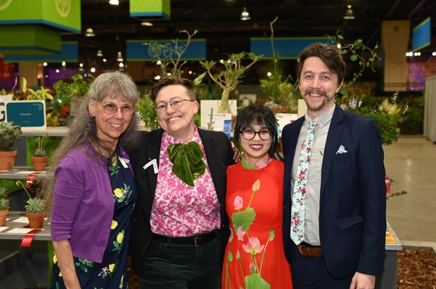 People pose for a photo at the Philadelphia Flower Show Preview Party