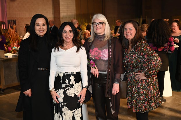 People pose for a photo at the Philadelphia Flower Show Preview Party