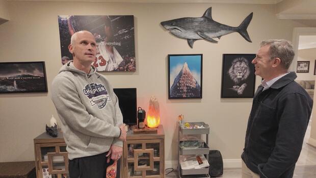 Dan Hurley in his basement sanctuary with Jon Wertheim 