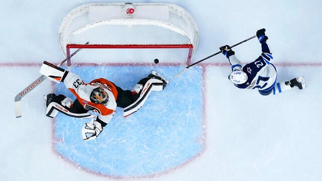 Overhead shot as the Winnipeg Jets' Nikolaj Ehlers scores a goal against Philadelphia Flyers' Samuel Ersson during the first period of an NHL hockey game in Philadelphia 