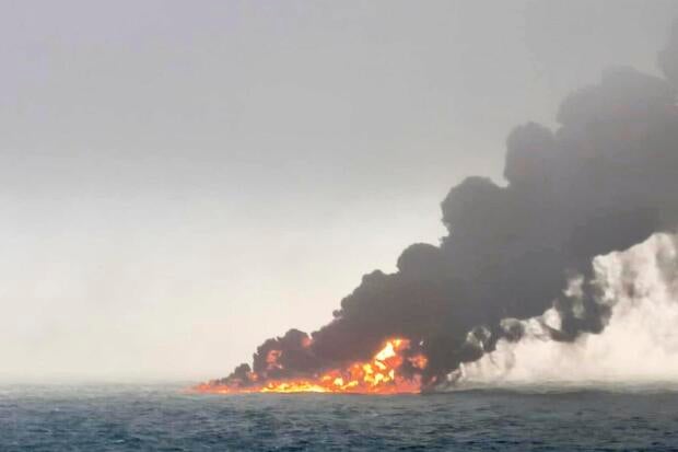 This image provided by Bartek Śmiałek shows smoke billowing from a vessel after a cargo ship hit a tanker carrying jet fuel off eastern England on March 10, 2025, setting both ablaze. 