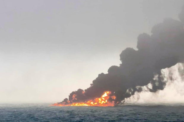 The image provided by Bartekśmiałek shows a cargo ship that was burning after crashing into an oil tanker in eastern England on March 10, 2025, and smoke was rolling from the ship, both burning.