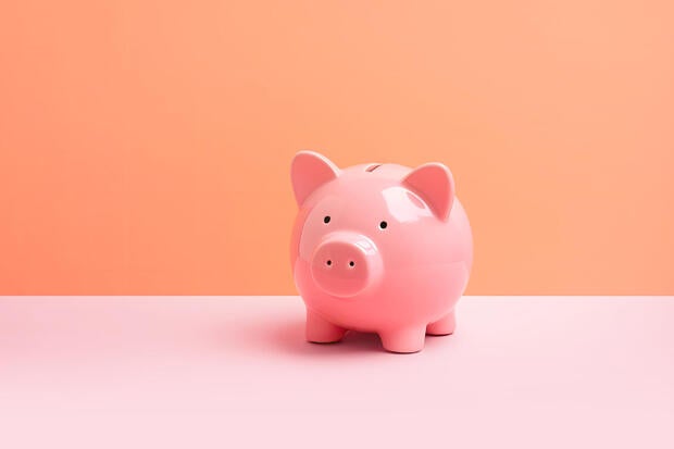 Pink piggybank on pastel background with copy space. Finance, technology, business analysis concept