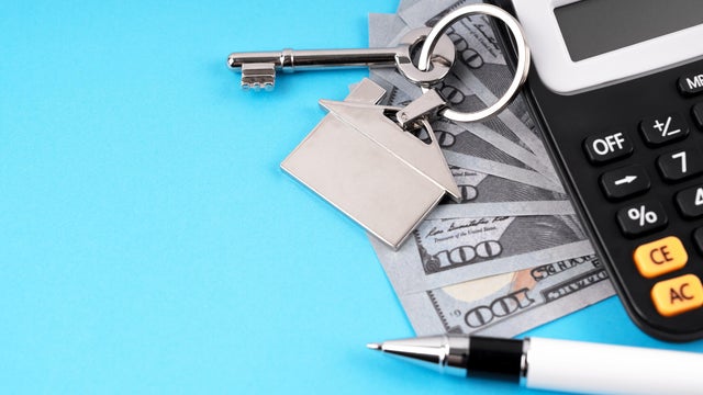 Paper Currency, House Key and Calculator 