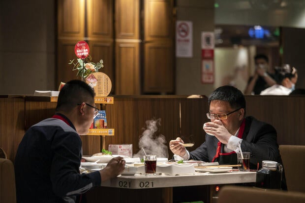 Eating place chain in China compensates 1000’s after diner stands on desk, urinates in hotpot