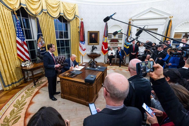 President Trump signs an executive order in the Oval Office at the White House in Washington, D.C., on Jan. 20, 2025. 