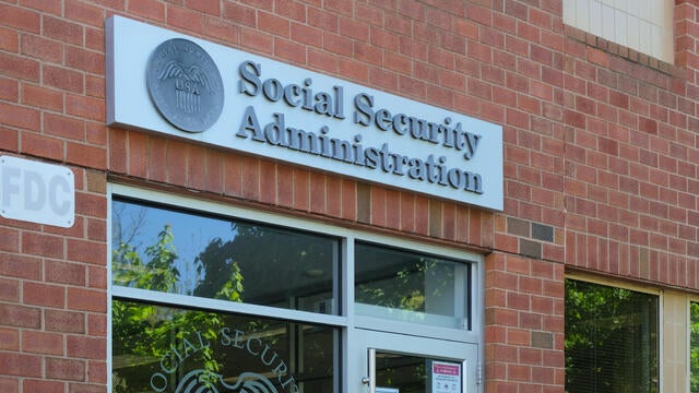 General view of Social Security Administration sign on building wall 