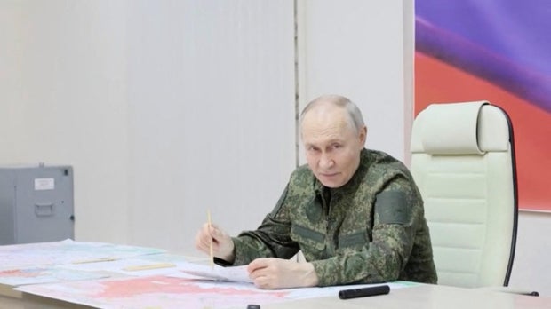 Russian President Putin visits the armed forces command center in the Kursk region