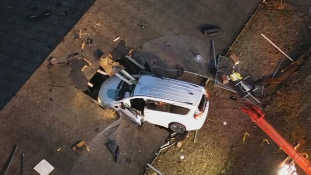 PHOTOS: Van crashes through roof of White Oak garage 