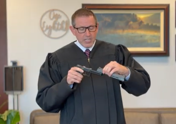 judge-holds-gun-screenshot-2025-03-21-082640.png 